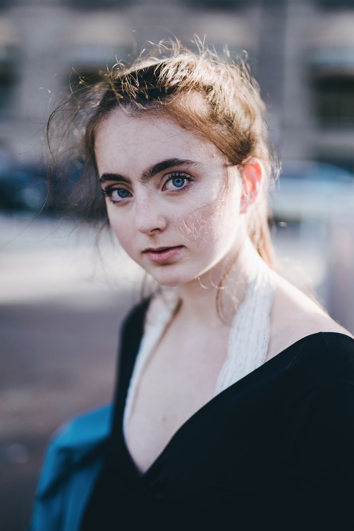 One women close up image looking ahead