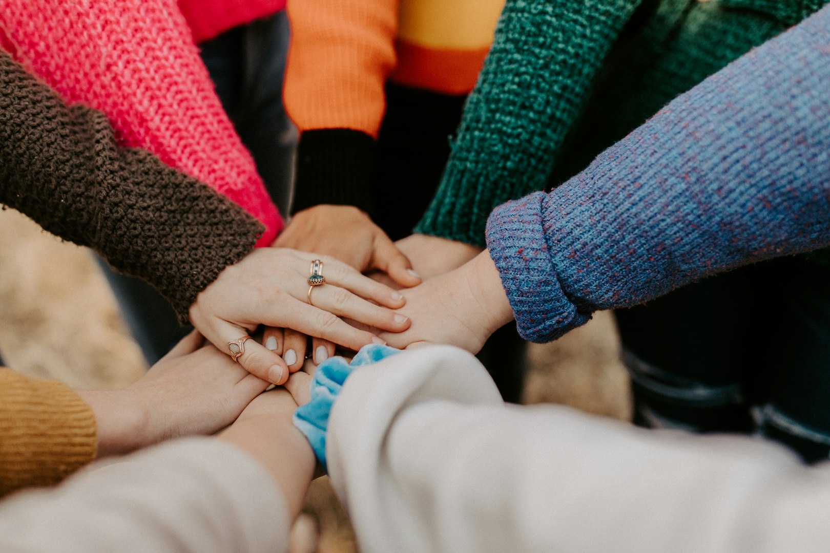 a diverse range of hand together.