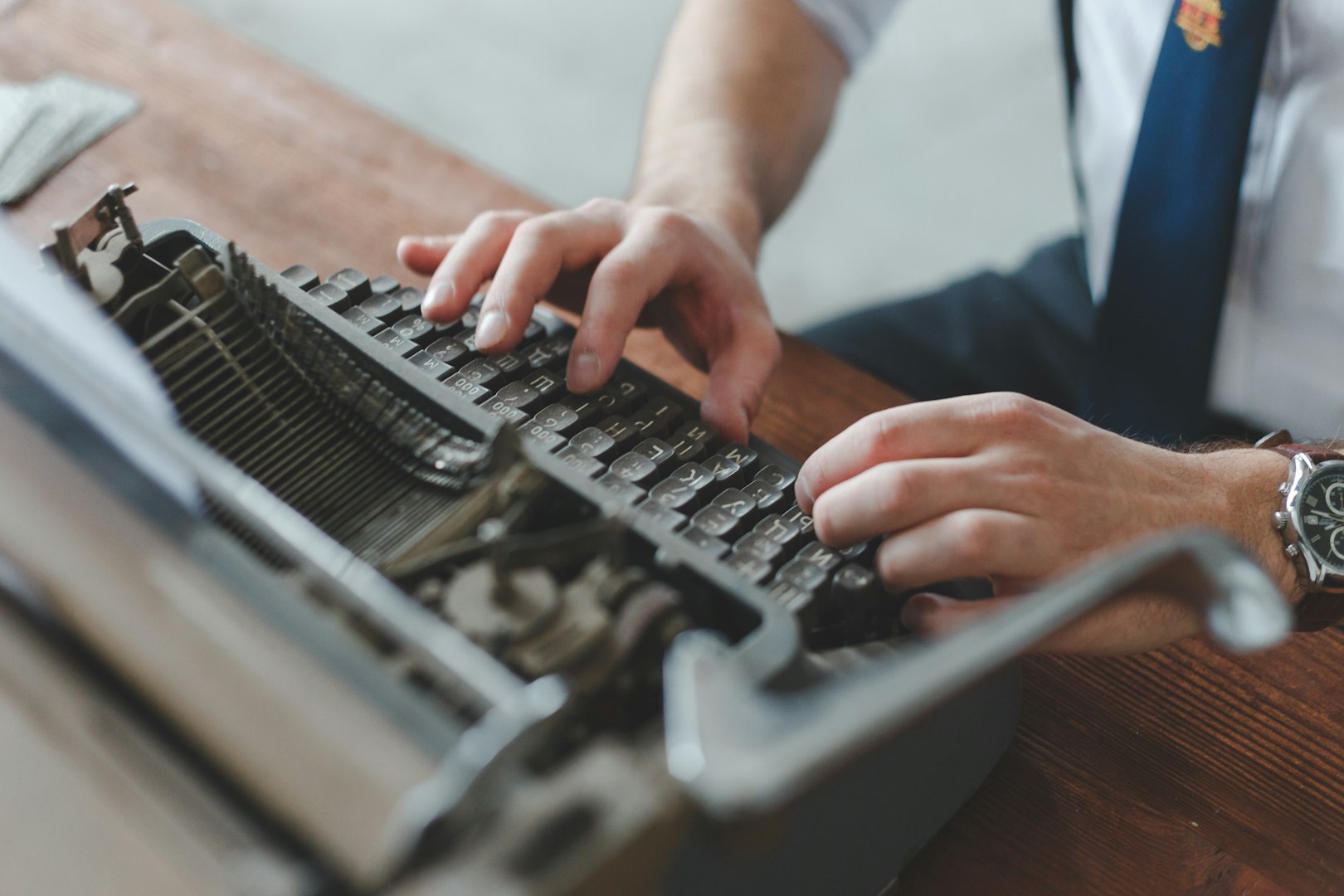 A Man typing his story on a typewriter