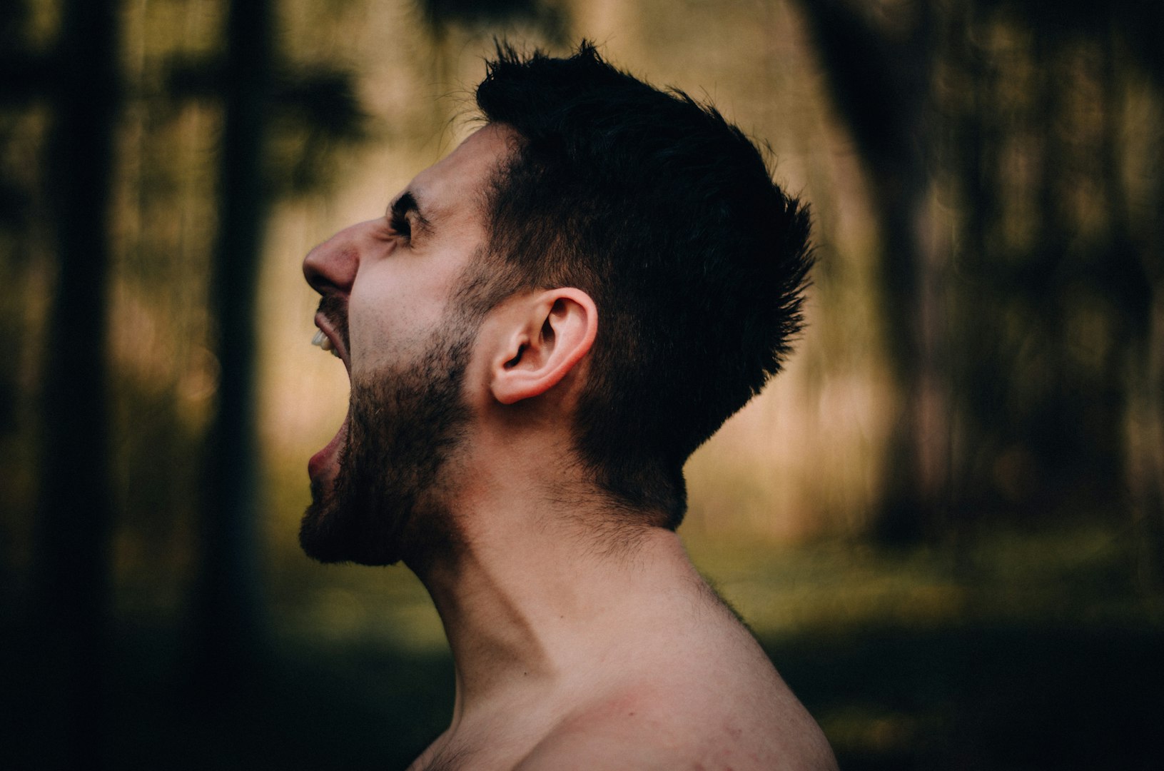 One man screaming with his head back